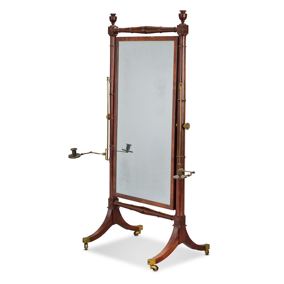 A Regency mahogany and brass mounted cheval mirror Circa 1815: A Regency mahogany and brass mounted cheval mirror Circa 1815 The rectangular swivel hinged plate encompassed by ring turned and ring turned baluster columnar frames, interspersed with concentric roun