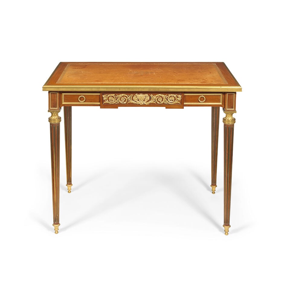 A French 19th century ormolu mounted mahogany table a écrire by Paul Sormani (1817-1877) Ci...: A French 19th century ormolu mounted mahogany table a écrire by Paul Sormani (1817-1877) Circa 1875 The rectangular gilt tooled leather inset top with an ovolo moulded and mille raie mounted edge
