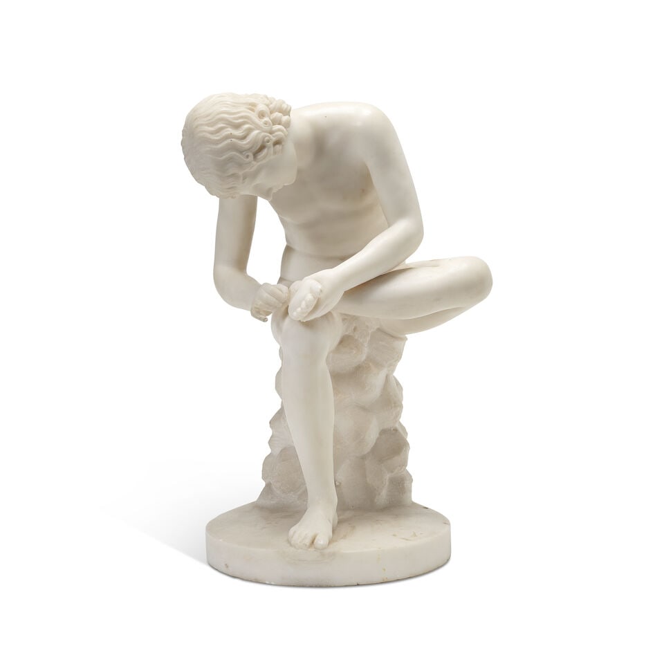 An Italian carved white marble figure of The Spinario After the antique, probably late 19th cent...: An Italian carved white marble figure of The Spinario After the antique, probably late 19th century, the rear with inset retailers pastille marked BELLMAN, IVEY & CARTER, NEW BOND STREET, BY APPOINTME