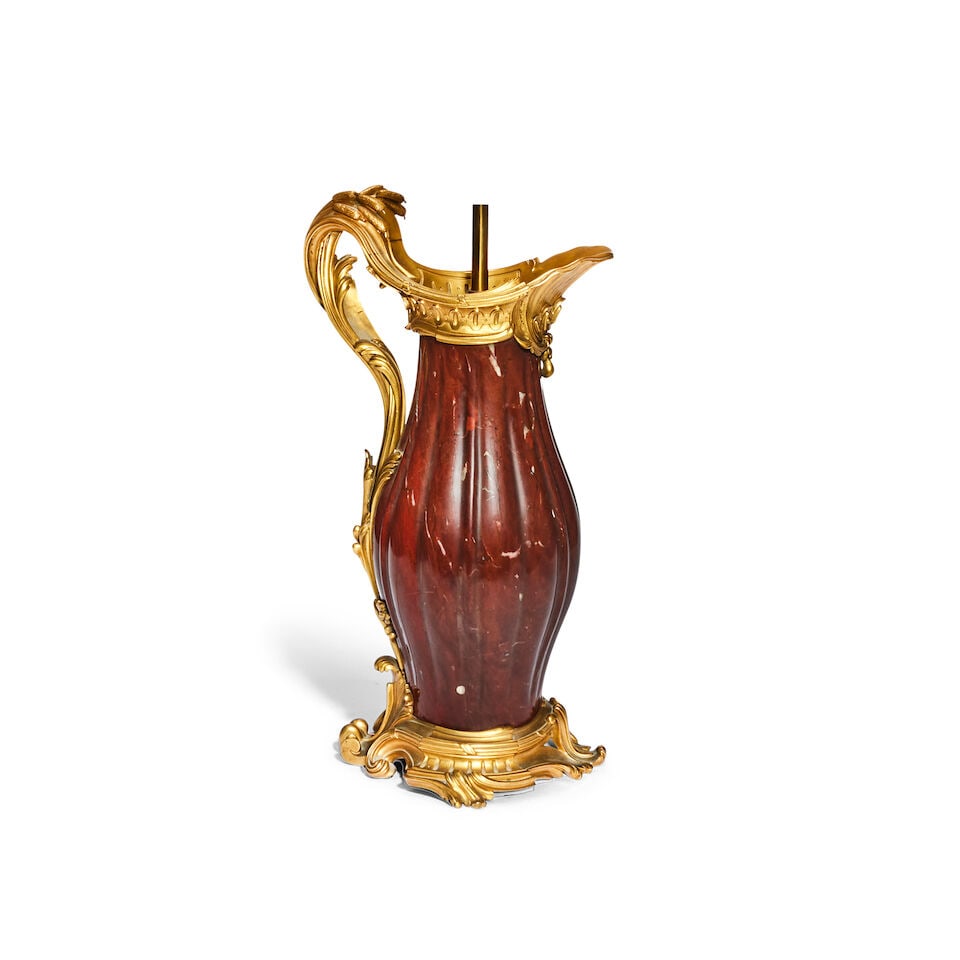 Paul Sormani (French, 1817-1877): A third quarter century French rouge marble and gilt bronze mo...: Paul Sormani (French, 1817-1877): A third quarter century French rouge marble and gilt bronze mounted garniture ewer, later converted to a lamp base The gadrooned baluster body mounted with a shell-fo