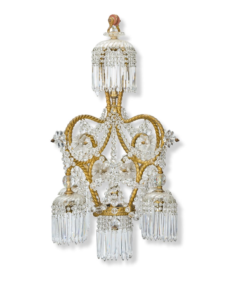 A late 19th/early 20th century French giltmetal and cut and moulded glass seven-light electrolie...: A late 19th/early 20th century French giltmetal and cut and moulded glass seven-light electrolier The rope twist frame in the manner of A. M. E. Fournier The four multi-scrolling arms issuing moulded