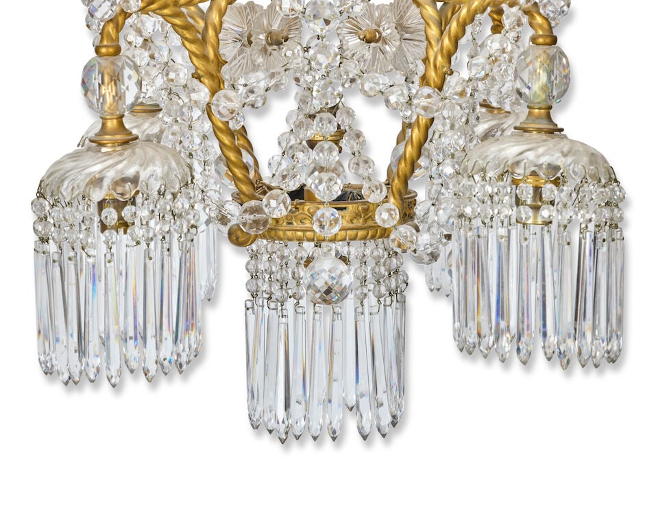 A late 19th/early 20th century French giltmetal and cut and moulded glass seven-light electrolie... - 2