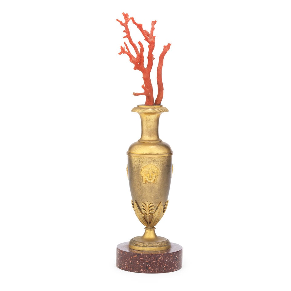 A gilt bronze and red coral mounted ornamental vase The vase in the Empire taste, probably Ital...: A gilt bronze and red coral mounted ornamental vase The vase in the Empire taste, probably Italian, parts 19th century and later The vase of slender shouldered ovoid form applied with three classical
