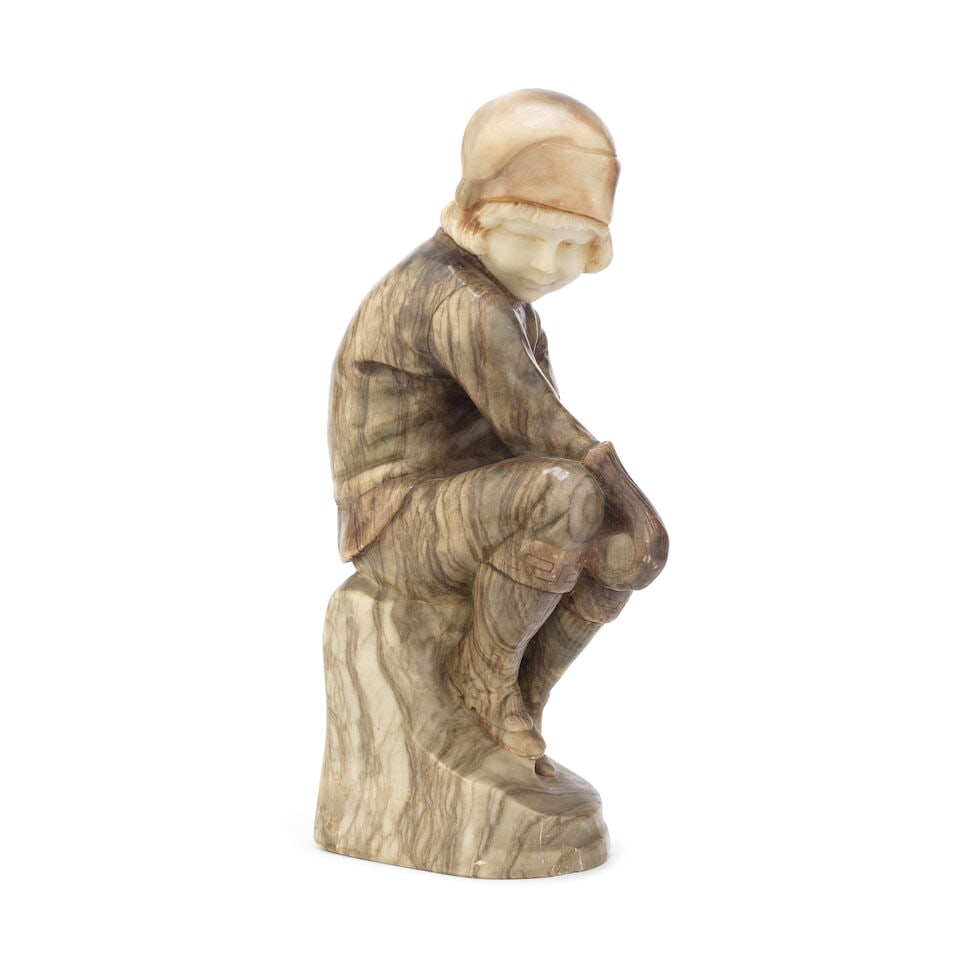 Rudolf Marcuse (German 1878 - 1930): A carved marble and alabaster figure of a seated girl: Rudolf Marcuse (German 1878 - 1930): A carved marble and alabaster figure of a seated girl The young girl dressed in winter attire, head turned to dexter wearing a hat, and holding a snowball in her h