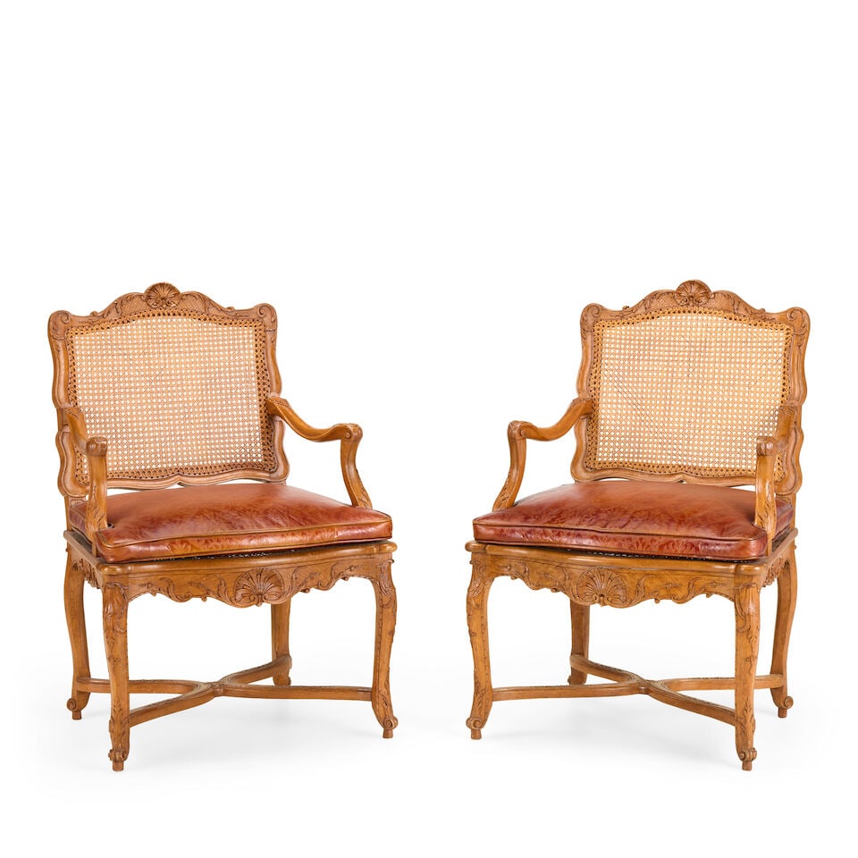 A pair of French 19th century Regence style stained beech fauteuils Both stamped: 'Pere Gourdin'...: A pair of French 19th century Regence style stained beech fauteuils Both stamped: 'Pere Gourdin' Each with shaped acanthus, husk, foliate, c- and s-scroll and shell carved frames, on slender cabriole