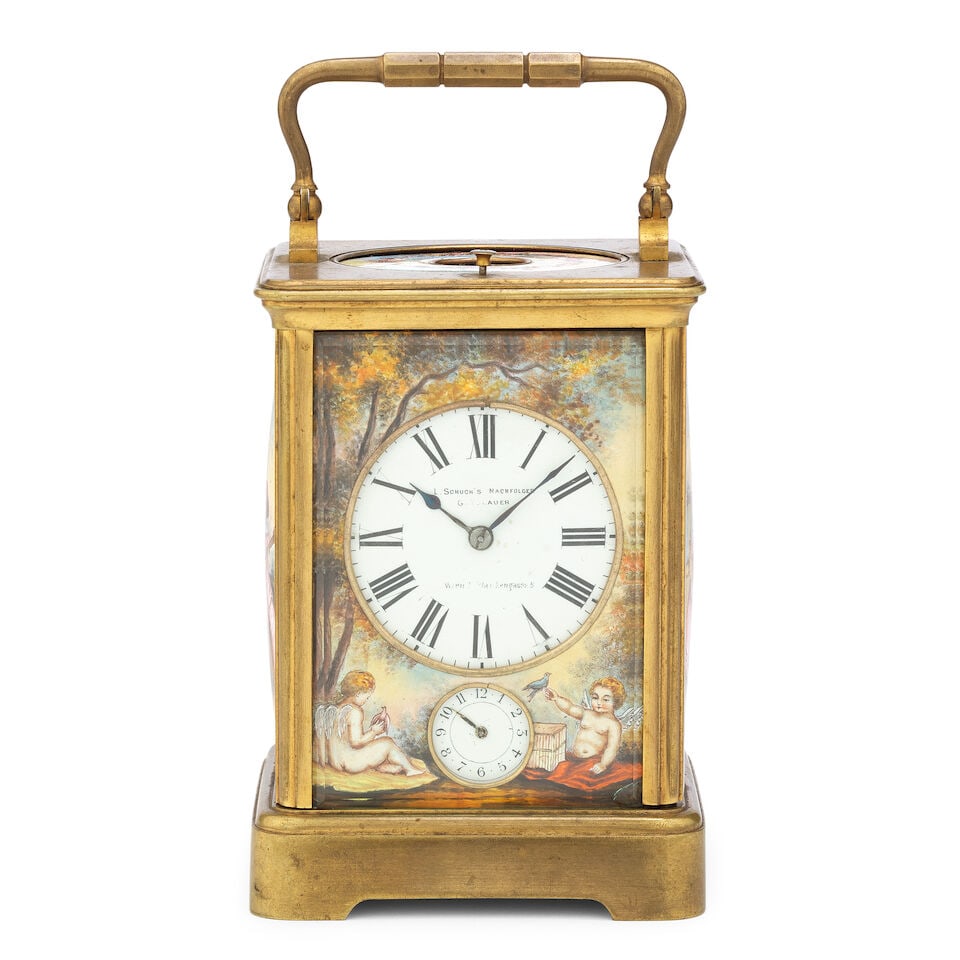 A late 19th century French gilt brass petite sonnerie carriage clock with enamel front back and ...: A late 19th century French gilt brass petite sonnerie carriage clock with enamel front back and side panels signed L Schuch's Nachfolger The case surmounted by a brass carrying handle over a moulded t