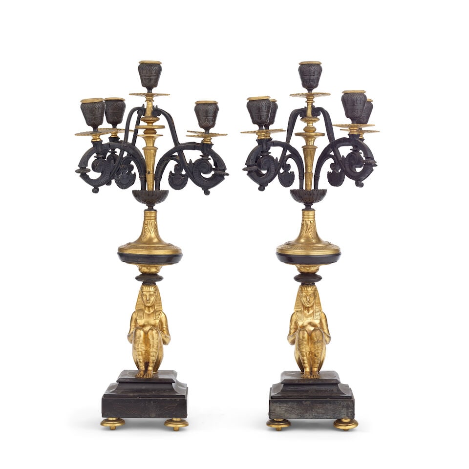 A pair of late 19th century French patinated and gilt bronze five-light figural candelabra In E... - 2