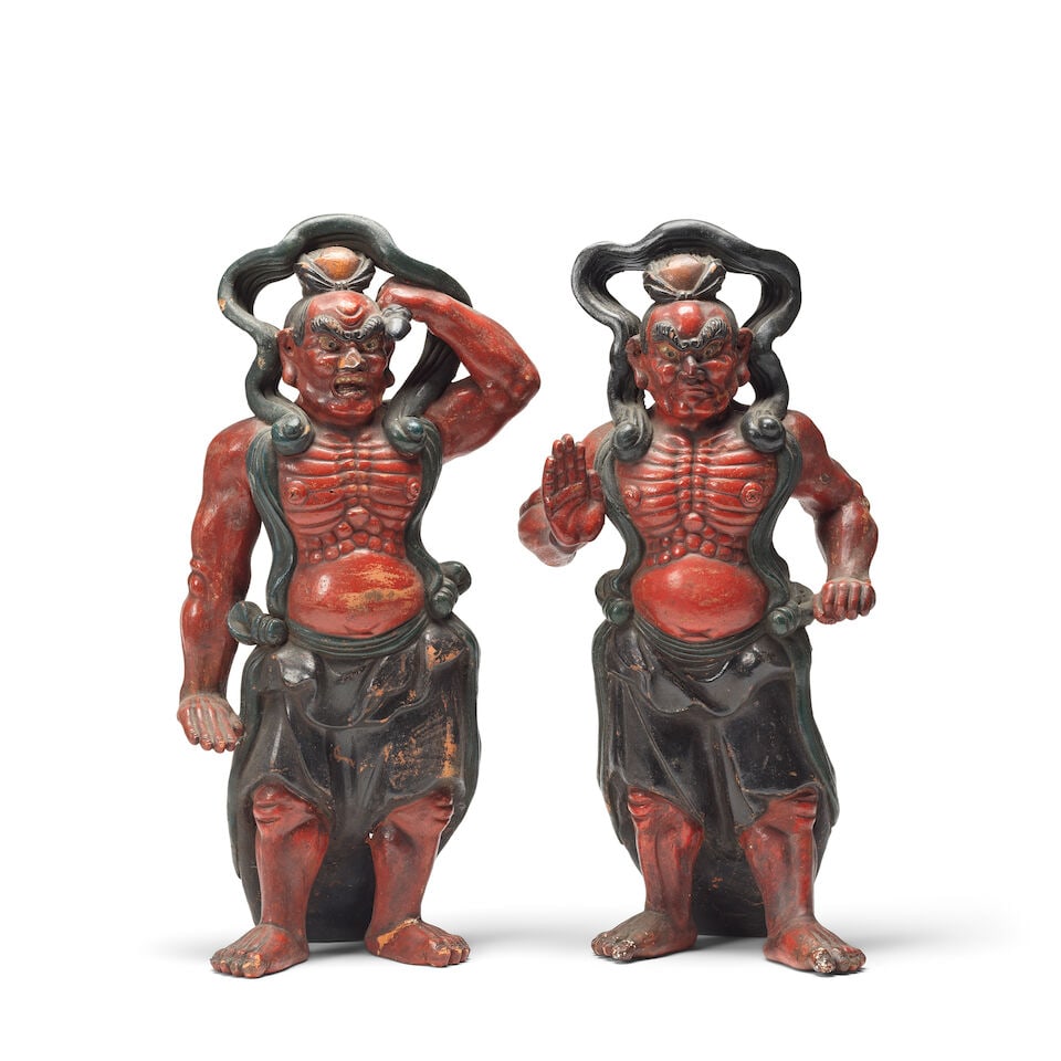 A pair of Japanese polychrome terracotta figures of Niō (temple guardians) Probably late Me...: A pair of Japanese polychrome terracotta figures of Niō (temple guardians) Probably late Meiji (1868-1912) period The red painted semi-clad warriors typically modelled with grimacing grotesque fa