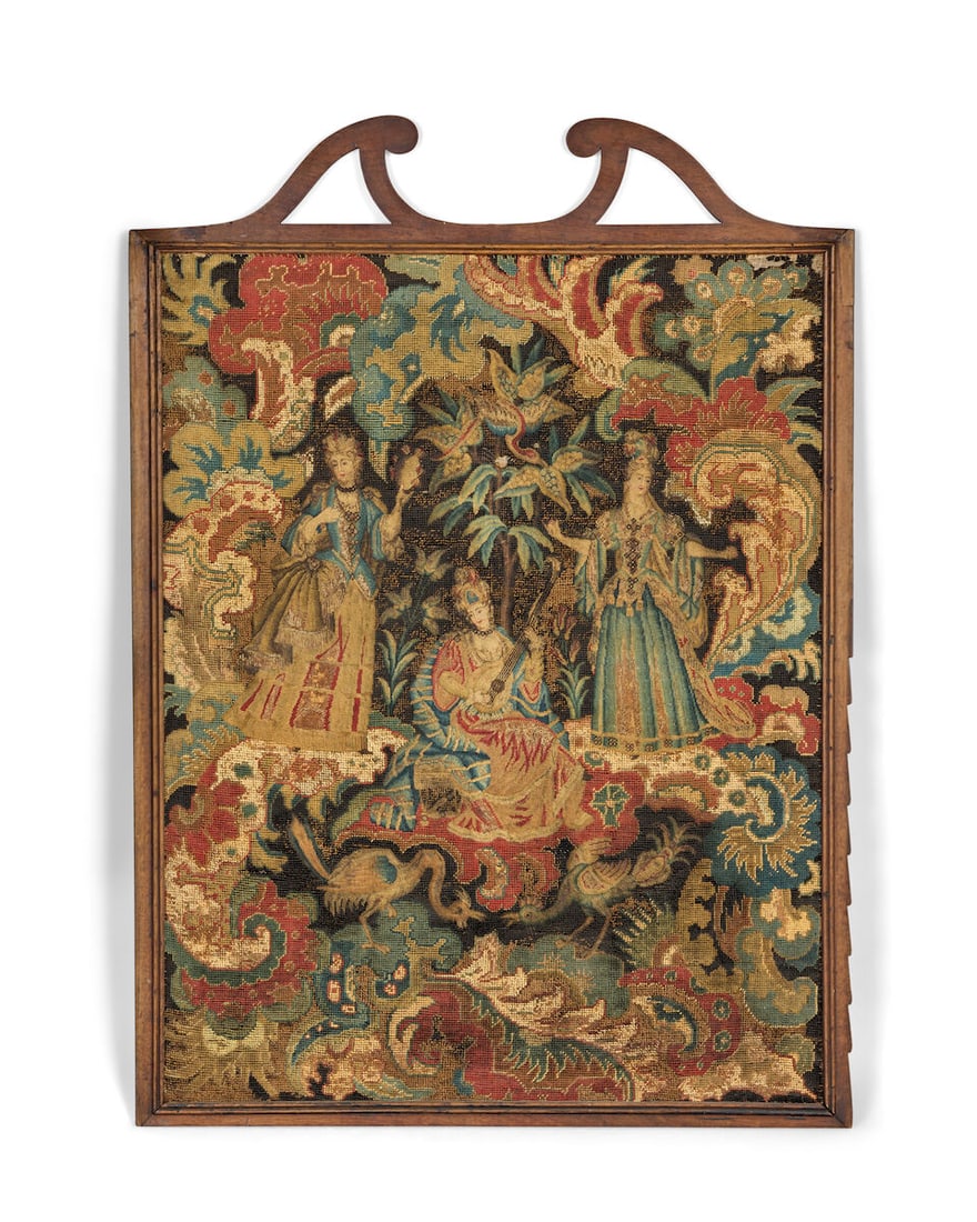 A Queen Anne or early 18th century needlework panel possibly depicting the Three Graces Possibly...: A Queen Anne or early 18th century needlework panel possibly depicting the Three Graces Possibly formerly part of a fire guard The three females in courtly dress, the central seated figure playing a l