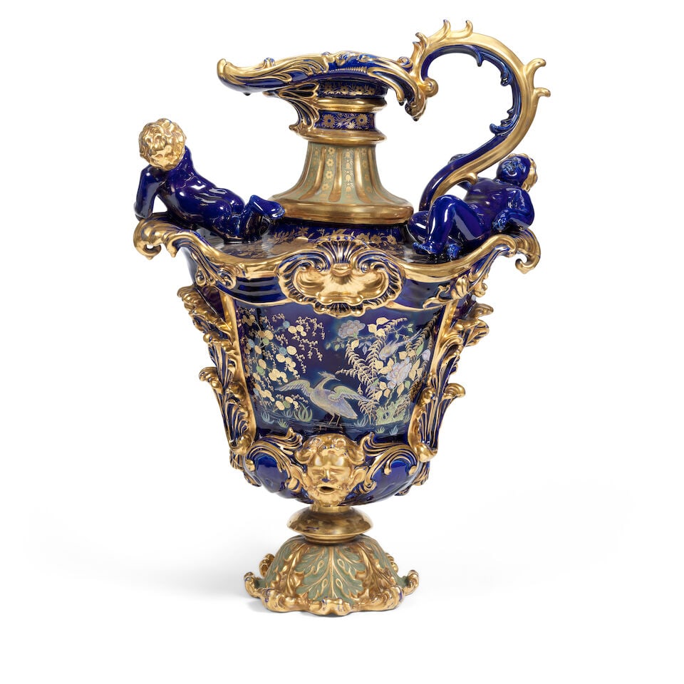 A late 19th century blue glazed and green enamelled decorative ironstone ewer Probably English: A late 19th century blue glazed and green enamelled decorative ironstone ewer Probably English Of elaborate acanthus and rocaille moulded shouldered baluster form, the swept neck with scrolling handle