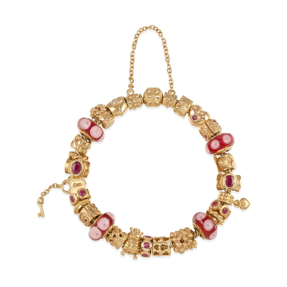 PANDORA: 14K GOLD CHARM BRACELET: PANDORA: 14K GOLD CHARM BRACELET • 14k yellow gold • Numerous round and oval synthetic rubies • Numerous round diamonds weighing approximately 0.10 - 0.20 carat total • Signed