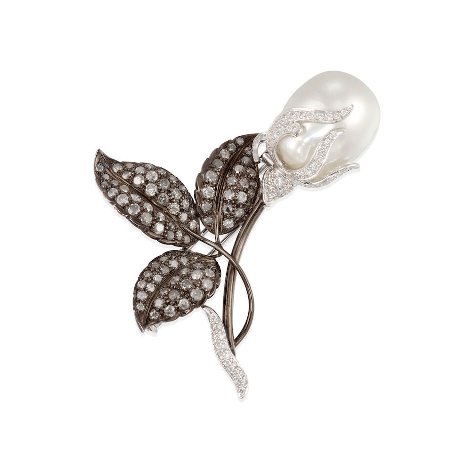 14K GOLD, DIAMOND, AND CULTURED PEARL BROOCH: 14K GOLD, DIAMOND, AND CULTURED PEARL BROOCH • 14k white gold and black oxidized gold • Numerous round diamonds weighing approximately 3.30 to 3.40 carats total • 1 oval shape