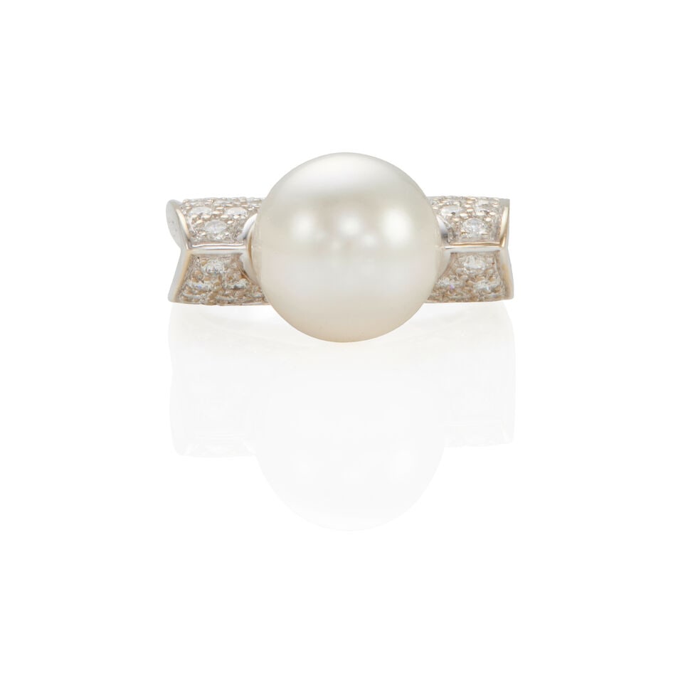 18K WHITE GOLD, CULTURED PEARL, AND DIAMOND RING: 18K WHITE GOLD, CULTURED PEARL, AND DIAMOND RING • 18k white gold • 1 spherical half-drilled cultured pearl measuring 11.20 mm in diameter • Numerous round diamonds weighing