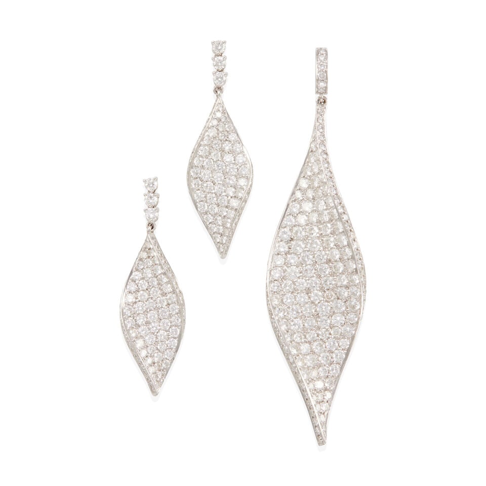 18K GOLD AND DIAMOND SET: 18K GOLD AND DIAMOND SET • One pendant of 18k white gold with numerous round diamonds weighing approximately 5.55 - 5.65 carats total, measures 3 x 3/4 in. • Pair of earrings of 18k white
