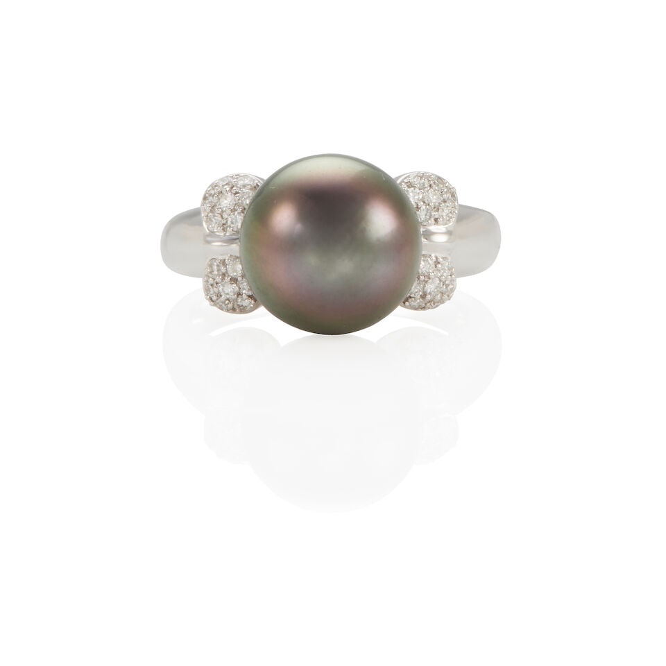 14K GOLD, DIAMOND AND CULTURED PEARL RING: 14K GOLD, DIAMOND AND CULTURED PEARL RING • 14k white gold • Numerous round diamonds stated to weigh 0.22 carat total • 1 round cultured pearl 11-12 mm • Size 7 •