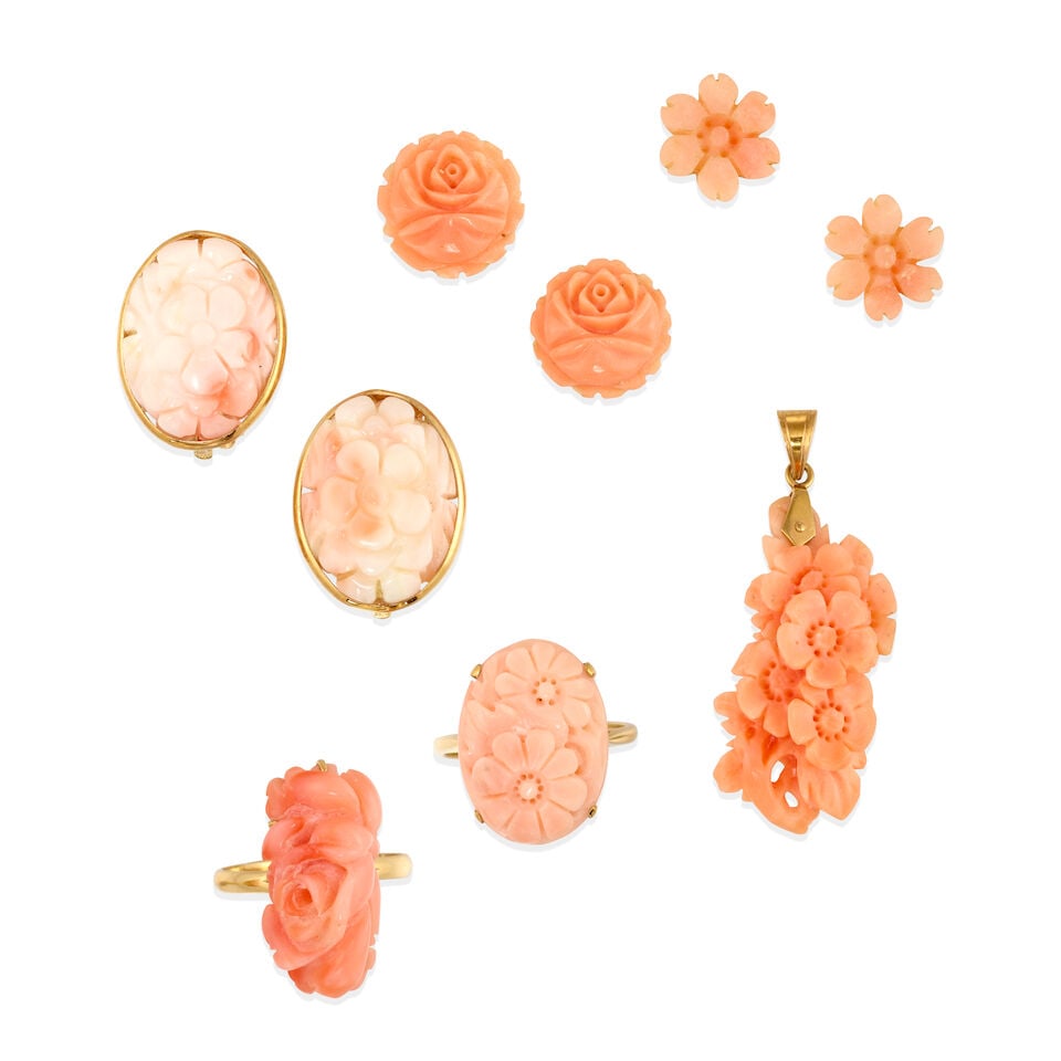 GROUP OF GOLD AND CORAL JEWELRY: GROUP OF GOLD AND CORAL JEWELRY • 14k yellow gold pendant with carved coral measuring approximately 30.00 x 15.00 x 9,50 mm, length: 1 ½ in • 14k yellow gold ring with oval carved