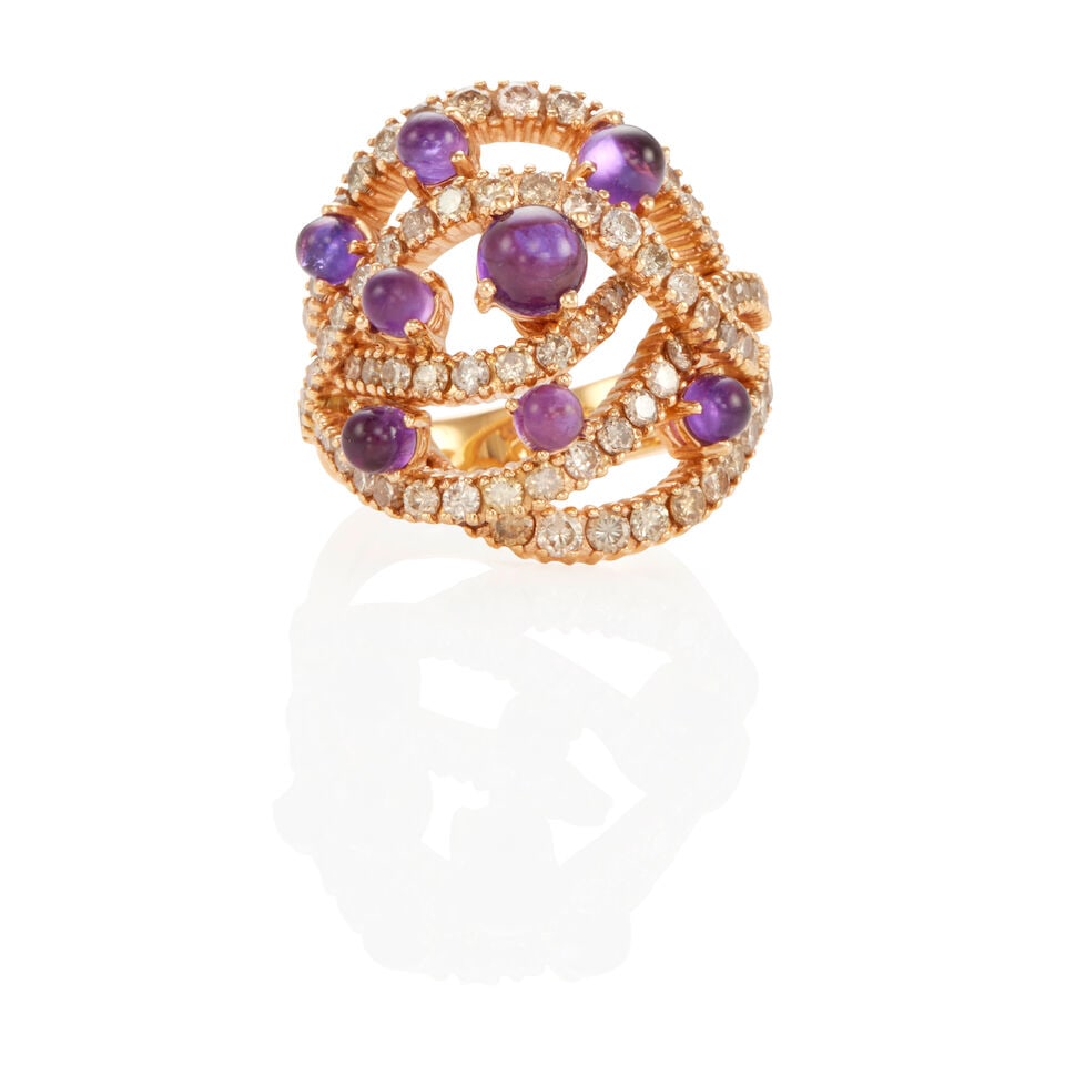 DAMIANI: 18K GOLD, DIAMOND AND AMETHYST RING: DAMIANI: 18K GOLD, DIAMOND AND AMETHYST RING • 18k rose gold • Numerous round diamonds weighing approximately 1.25 - 1.35 carat total • Numerous round amethyst cabochons 2.5 - 5.05