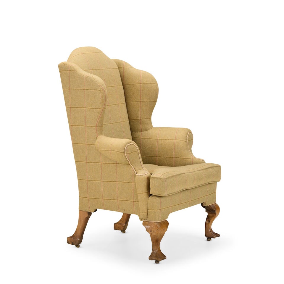 A George II elm wingback armchairMid-18th century and later - 2