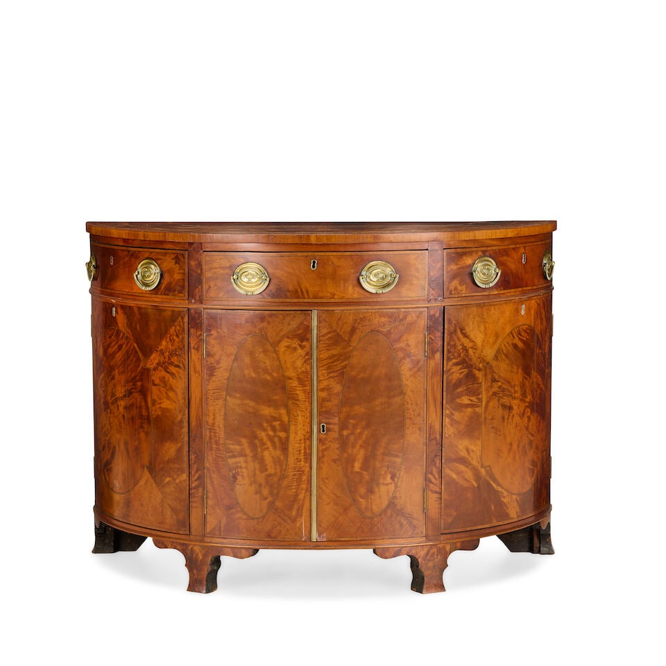 A George III and later satinwood, pollard elm and marquetry side cabinetLate 18th century and later: A George III and later satinwood, pollard elm and marquetry side cabinet Late 18th century and later The crossbanded top inlaid with oak leaves and acorns above a central frieze drawer and two hinged