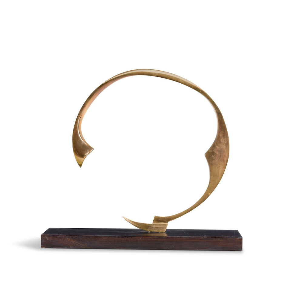 British School, 20th Century: a brass stylised crescent (1 of 3)