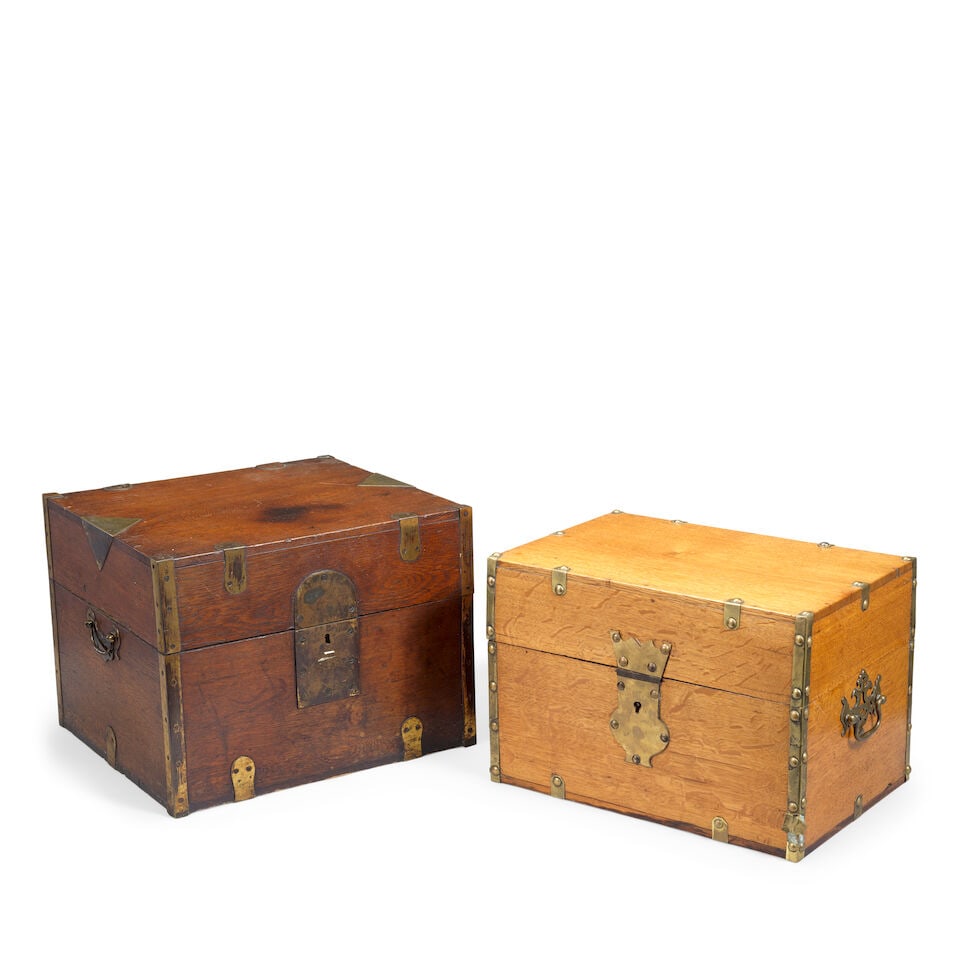 Two large oak and brass bound decanter sets First half 19th century (2): Two large oak and brass bound decanter sets First half 19th century Each with an extensive collection of square, gilt-decorated clear glass bottles and glasses, 38cm wide, 33.5cm deep, 28.5cm high (14