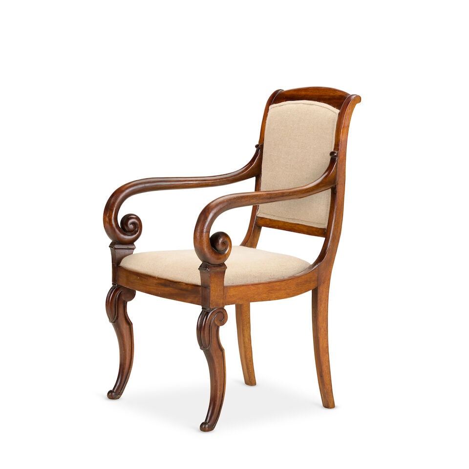 A Louis-Phillippe mahogany armchairMid-19th century: A Louis-Phillippe mahogany armchair Mid-19th century With upholstered back and seat, with scrolled arms and front cabriole legs, 54cm wide x 57cm deep x 90cm high, (21in wide x 22in deep x 35in high)