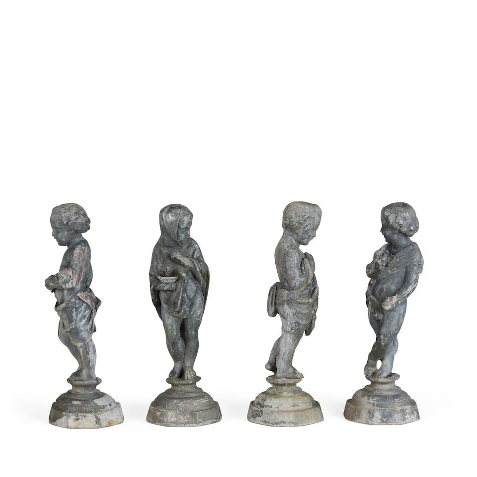 A set of four lead putti depicting The Four Seasons 20th century (4) (1 of 6)