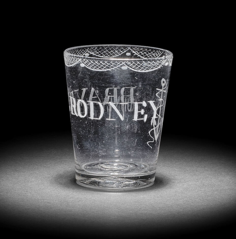 A small engraved Admiral Lord Rodney commemorative tumbler, circa 1780: A small engraved Admiral Lord Rodney commemorative tumbler, circa 1780 The plain tapering form of attractive small size, engraved with a fouled anchor and inscribed 'BRAVE RODNEY', a border of stylise