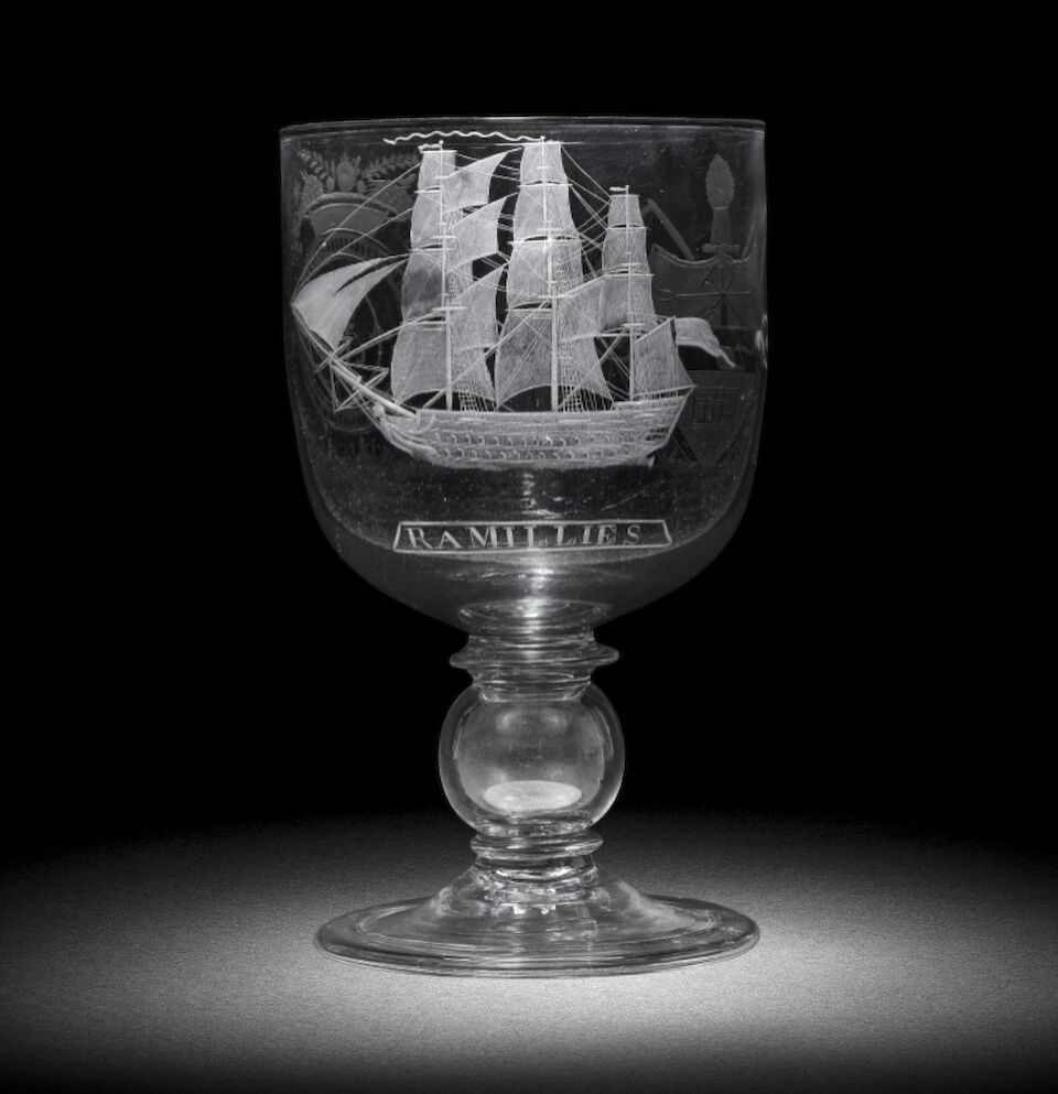 An engraved armorial coin rummer, early 19th century, the coin dated 1811: An engraved armorial coin rummer, early 19th century, the coin dated 1811 The generous cup-shaped bowl decorated with a three-masted ship in full sail, titled 'RAMILLIES' on a banner below, together w