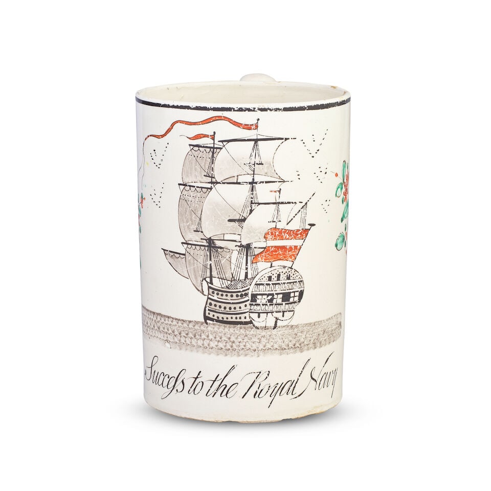 A large creamware mug, circa 1790-1800: A large creamware mug, circa 1790-1800 Painted in black with a fine Man of War in full sail on choppy waters, a red and white ensign at the stern, above the inscription 'Success to the Royal Navy', re