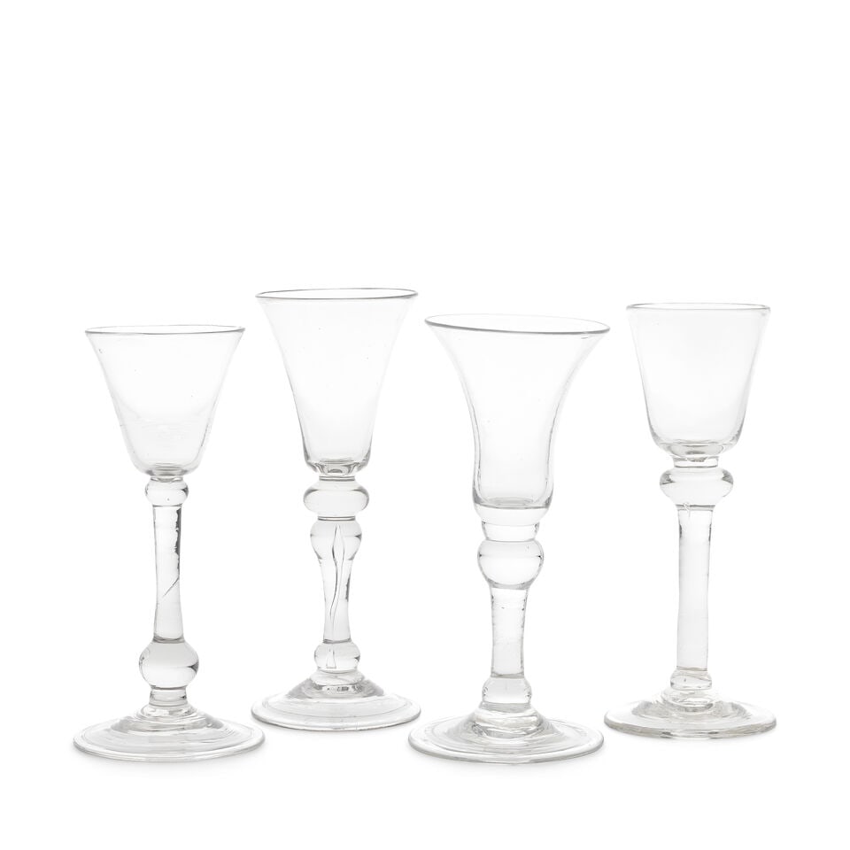 Four baluster wine glasses, circa 1730-50: Four baluster wine glasses, circa 1730-50 Two with round funnel bowls, including one on a slender true baluster stem and conical folded foot; and one with a teared shoulder-knop and plain conical foot