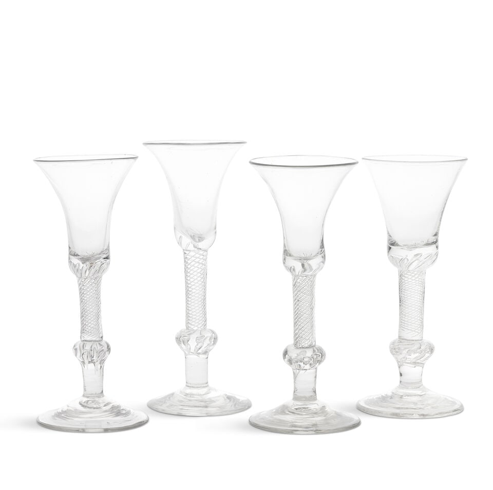 Four composite stem wine glasses, circa 1750: Four composite stem wine glasses, circa 1750 The waisted bell bowls with solid bases, on multi-spiral airtwist stems with threads extending into the bases of the bowls, set into beaded inverted balust