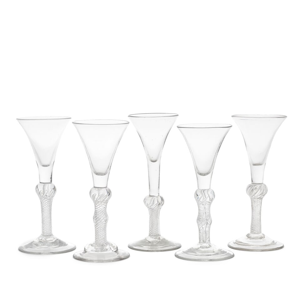 Five good composite stem wine glasses, circa 1750: Five good composite stem wine glasses, circa 1750 With drawn trumpet bowls, the stems with upper short plains sections above multi-spiral airtwist stems, comprising three of inverted baluster form wit