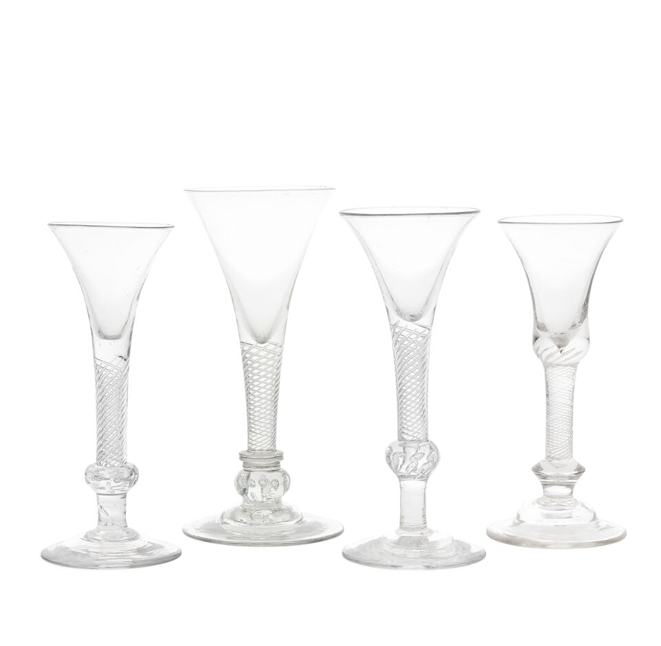 Four composite stem wine glasses, circa 1750: Four composite stem wine glasses, circa 1750 Set on multi-spiral airtwist stems, one with a generous drawn trumpet bowl, the stem set on a triple-collar above a breaded knop and domed foot; one with a