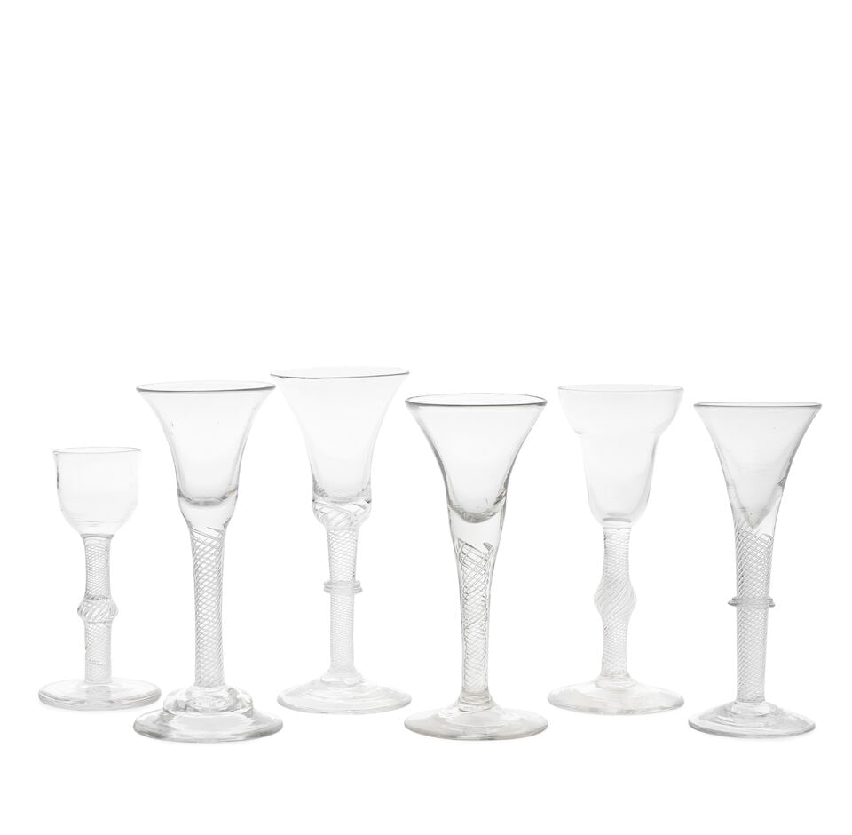 Six airtwist wine glasses, circa 1750: Six airtwist wine glasses, circa 1750 With multi-spiral airtwist stems, comprising two swelling into central angular knops, including one with an ogee bowl on a heavy 'firing' foot; and one with a pan