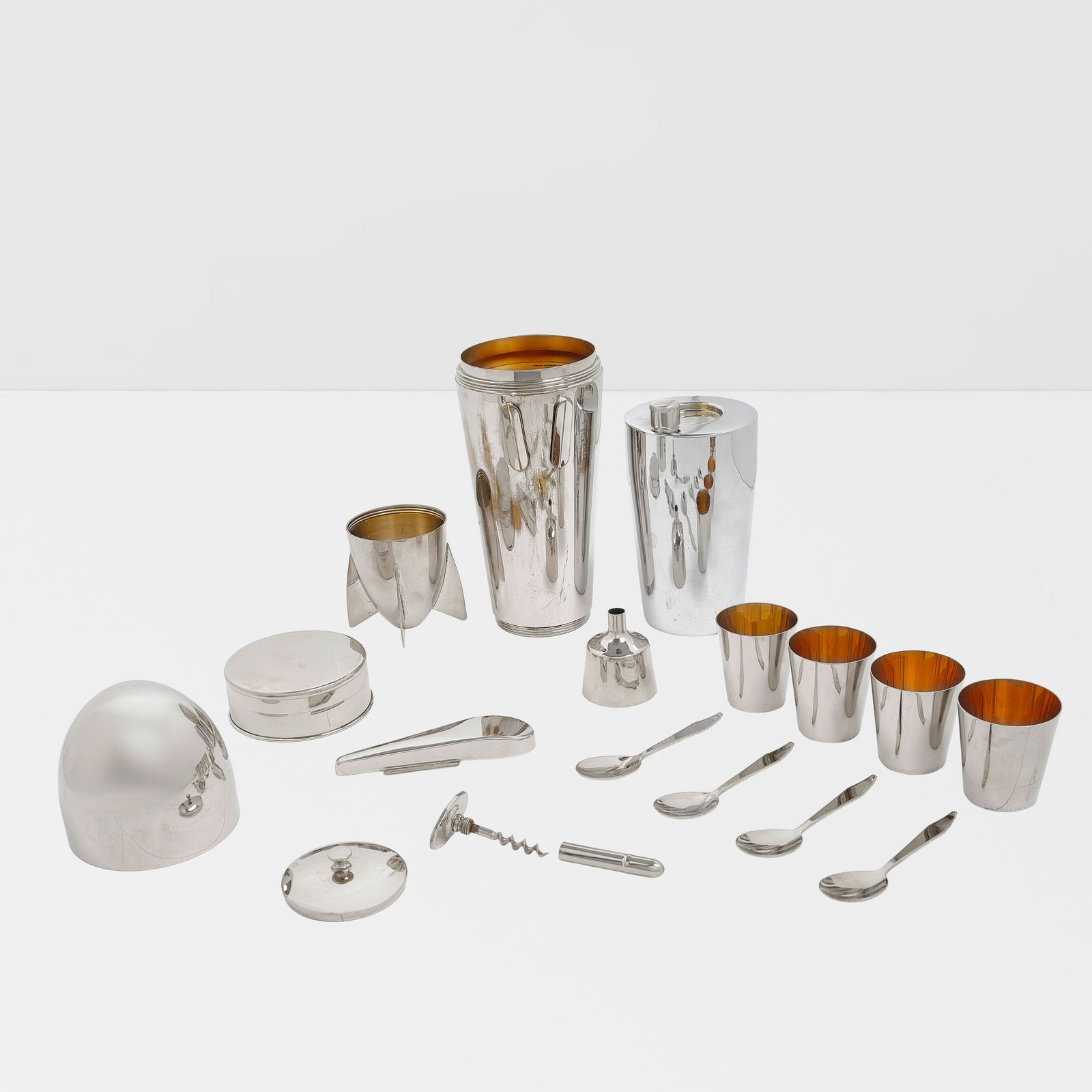 ATTRIBUTED TO J.A. HENCKELS (FOUNDED 1731) Zeppelin Cocktail Shaker and Traveling Barcirca 1928s...: ATTRIBUTED TO J.A. HENCKELS (FOUNDED 1731) Zeppelin Cocktail Shaker and Traveling Bar circa 1928 silver-plated brass, comprising four cups, four spoons, flask with cap, cocktail shaker with strainer a