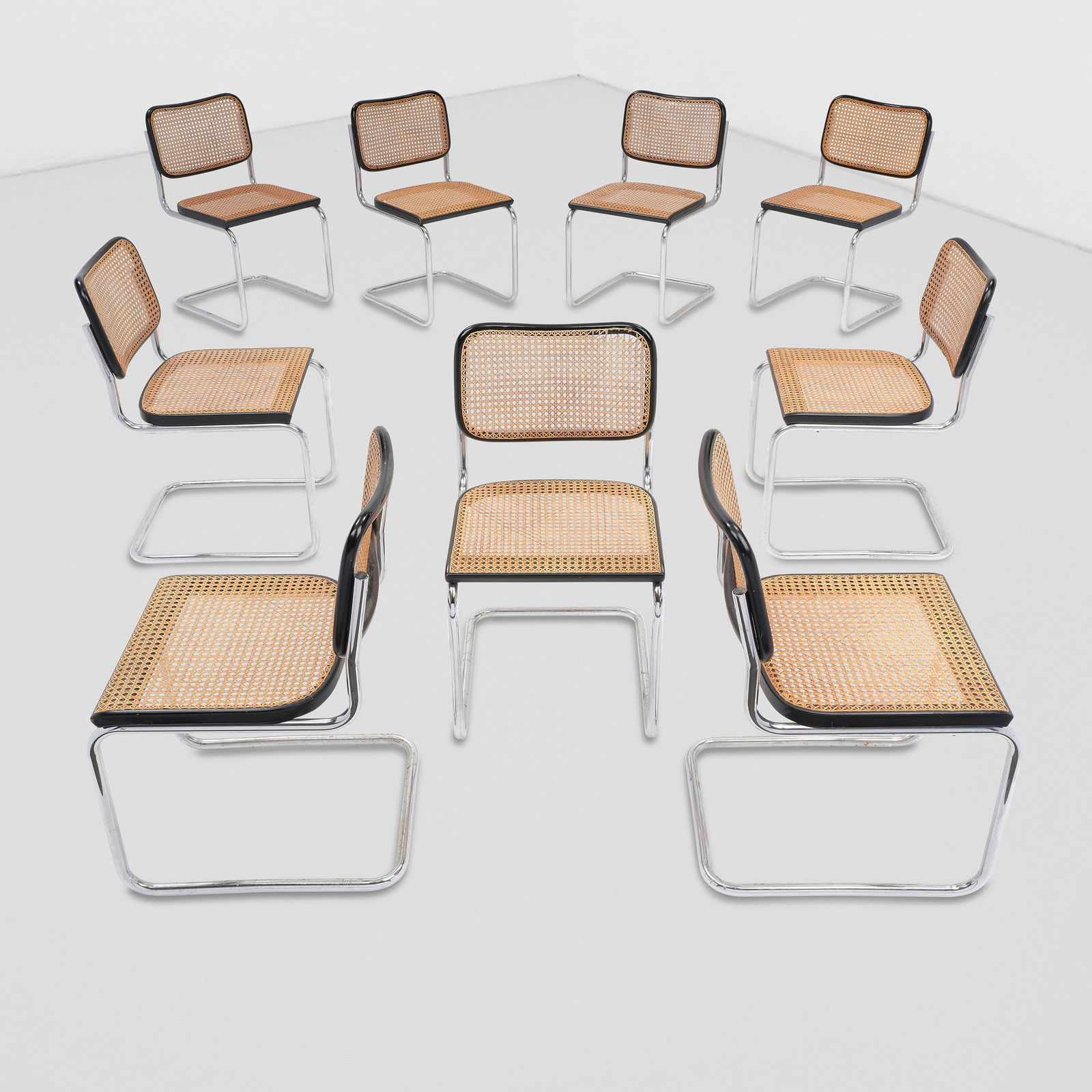 MARCEL BREUER (1902-1981) Set of Nine Chairsdesigned 1928for Knoll, chrome-plated steel, painted...: MARCEL BREUER (1902-1981) Set of Nine Chairs designed 1928 for Knoll, chrome-plated steel, painted wood, cane, each with Knoll and Gavina silver stickers height of each 32in (80.8cm), width 18in (45.7