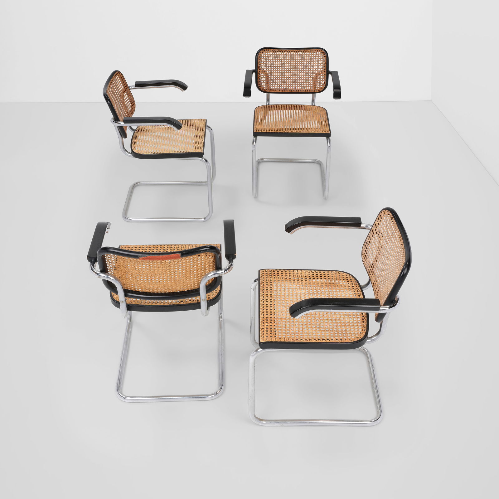 MARCEL BREUER (1902-1981) Set of Four Cesca Armchairsdesigned 1928for Knoll, chrome-plated steel...: MARCEL BREUER (1902-1981) Set of Four Cesca Armchairs designed 1928 for Knoll, chrome-plated steel, painted wood, cane, each with Knoll sticker height of each 31in (78.8cm), width 22 1/4in (56.5cm), d
