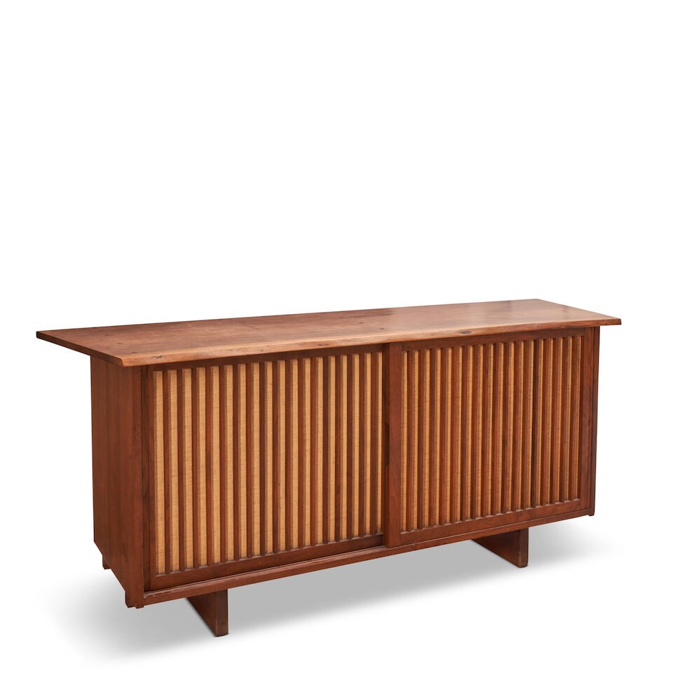 GEORGE NAKASHIMA (1905-1990) SLIDING-DOOR CABINET New Hope, Pennsylvania, 1967, American black w...: GEORGE NAKASHIMA (1905-1990) SLIDING-DOOR CABINET New Hope, Pennsylvania, 1967, American black walnut, oak, pandanus cloth, the top with overhanging free edge, unmarked, ht. 31 3/4, wd. 72, dp. 22 3/4