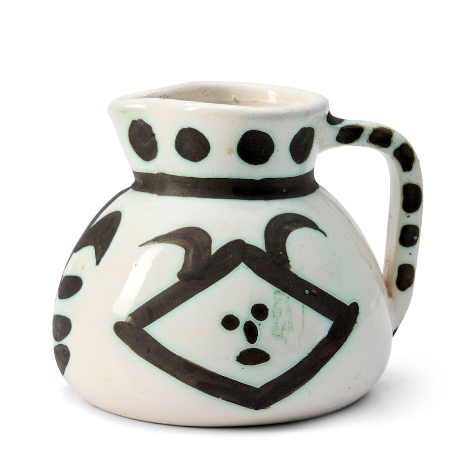 PABLO PICASSO (1881-1973) 'TETES' PITCHER Vallauris, France, Madoura Pottery, designed 1956, edi...: PABLO PICASSO (1881-1973) 'TETES' PITCHER Vallauris, France, Madoura Pottery, designed 1956, edition of 500, Ramie 368, earthenware with paraffin decoration, glazed mark 'Edition Picasso Madoura,' imp