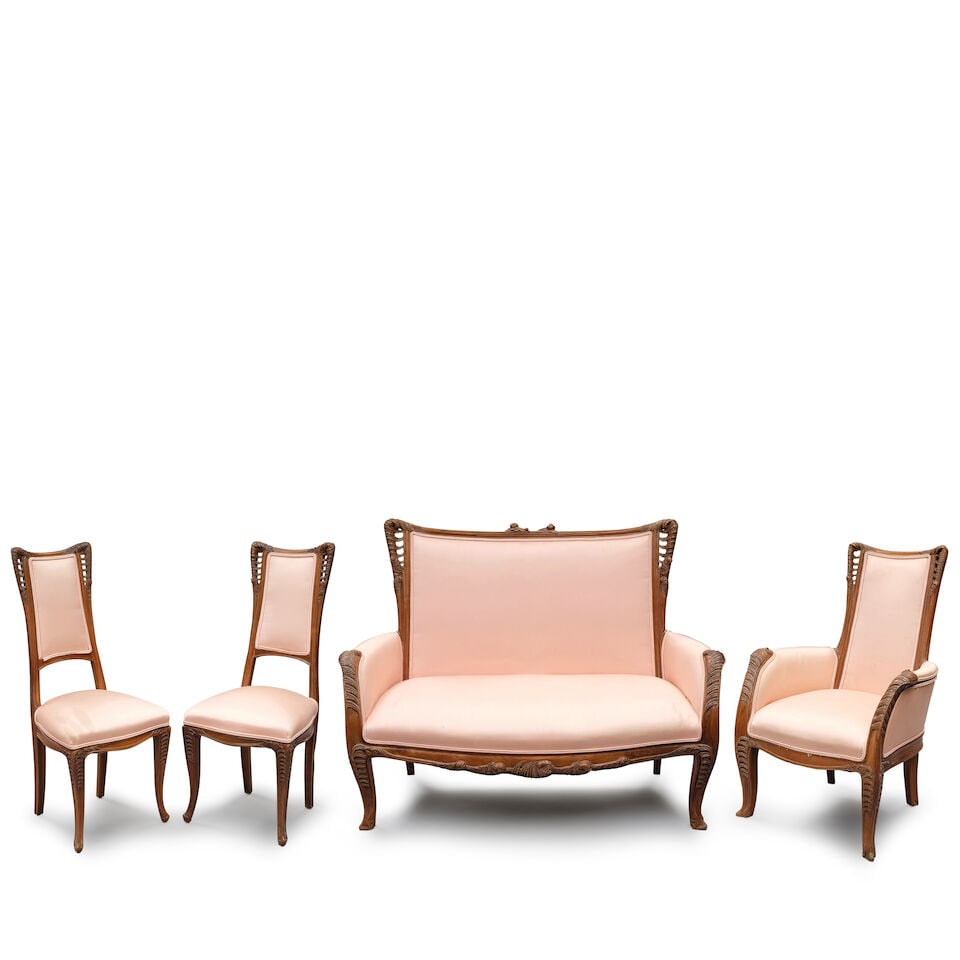 FOUR-PIECE LOUIS MAJORELLE (1859-1926) 'FOUGERES' SALON SUITE France, circa 1905, walnut, satin ...: FOUR-PIECE LOUIS MAJORELLE (1859-1926) 'FOUGERES' SALON SUITE France, circa 1905, walnut, satin upholstery, comprising a settee, ht. 43, wd. 53 3/4, dp. 28 1/2, pair of side chairs, ht. 39 1/2, wd. 16