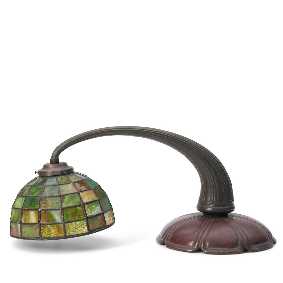 HANDEL COMPANY LEADED GLASS PIANO LAMP circa 1910, patinated bronze, glass, single socket, base ...: HANDEL COMPANY LEADED GLASS PIANO LAMP circa 1910, patinated bronze, glass, single socket, base with molded mark 'Handel,' shade unmarked, base ht. 8, lg. 16, dp. 7 1/2, shade dia. 7 in. For further i