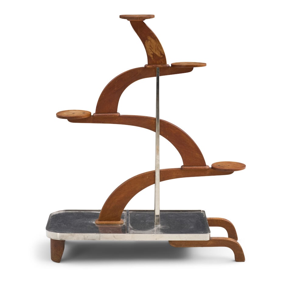 ART DECO PLANT STAND IN THE MANNER OF ANDRE GROULT probably France, circa 1935, mahogany, stainl... (1 of 2)