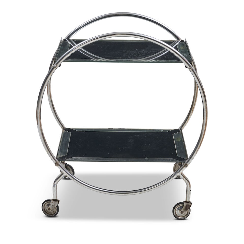 ART DECO DRINKS TROLLEY circa 1935, chromed steel, black enameled and mirror glass, unmarked, ht...: ART DECO DRINKS TROLLEY circa 1935, chromed steel, black enameled and mirror glass, unmarked, ht. 31, wd. 26 1/2, dp. 18 in. For further information on this lot please visit Bonhams.com For further in