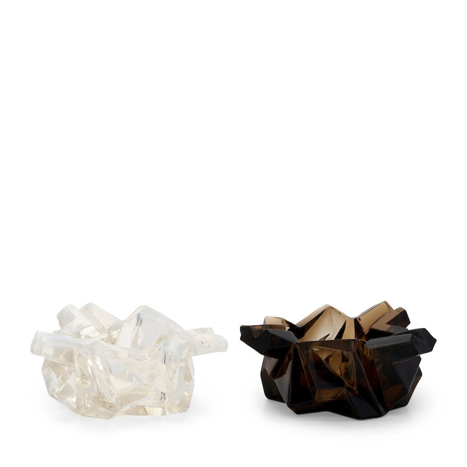 TWO REUBEN HALEY (1872-1933) FOR CONSOLIDATED LAMP AND GLASS CO. 'RUBA ROMBIC' ASHTRAYS Coraopol...: TWO REUBEN HALEY (1872-1933) FOR CONSOLIDATED LAMP AND GLASS CO. 'RUBA ROMBIC' ASHTRAYS Coraopolis, Pennsylvania, circa 1930, mold-blown iridescent white and smokey topaz glass, unmarked, ht. 2 in. Fo