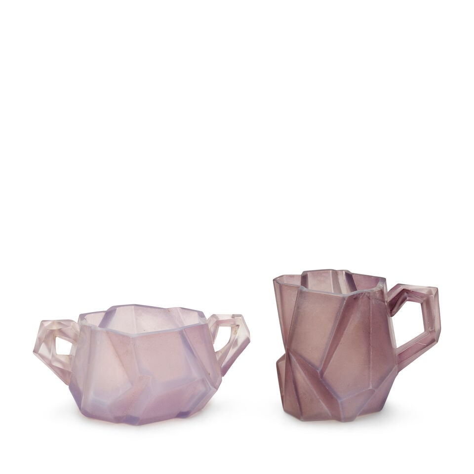 REUBEN HALEY (1872-1933) FOR CONSOLIDATED LAMP AND GLASS CO. 'RUBA ROMBIC' SUGAR AND CREAMER Cor...: REUBEN HALEY (1872-1933) FOR CONSOLIDATED LAMP AND GLASS CO. 'RUBA ROMBIC' SUGAR AND CREAMER Coraopolis, Pennsylvania, circa 1930, mold-blown lavender glass, unmarked, open sugar ht. 2 1/2, handle to 