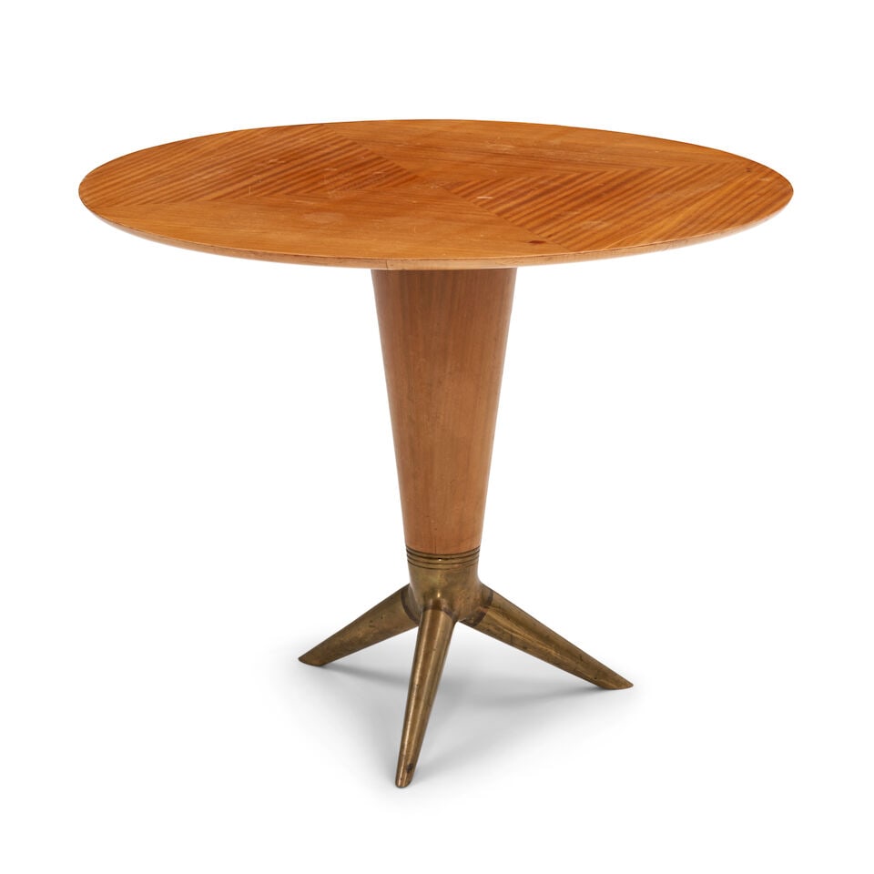 I.S.A. CENTER TABLE Bergamo, Italy, circa 1955, maple, brass, unmarked, ht. 31, dia. 39 1/4 in.: I.S.A. CENTER TABLE Bergamo, Italy, circa 1955, maple, brass, unmarked, ht. 31, dia. 39 1/4 in. For further information on this lot please visit Bonhams.com For further information about this lot plea