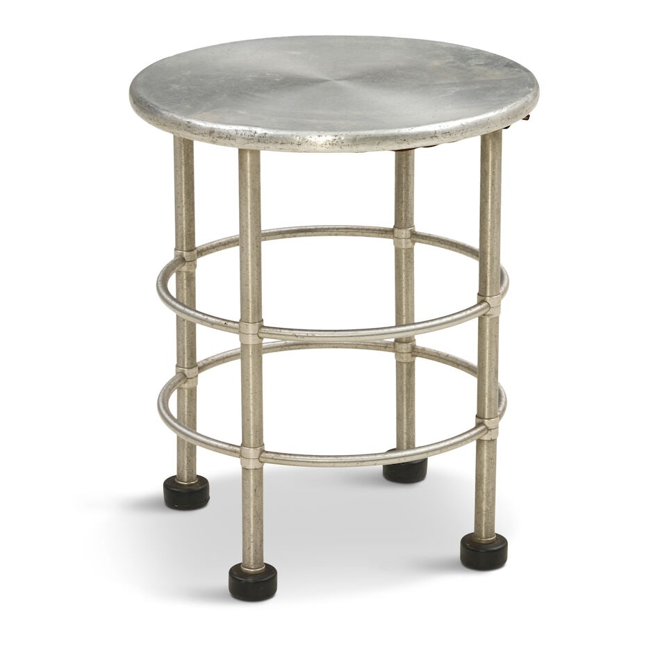 WARREN MCARTHUR (1885-1961) OCCASIONAL TABLE New York, circa 1935, aluminum, plywood, rubber, un...: WARREN MCARTHUR (1885-1961) OCCASIONAL TABLE New York, circa 1935, aluminum, plywood, rubber, unmarked, ht. 20, dia. 16 3/4 in. For further information on this lot please visit Bonhams.com For further