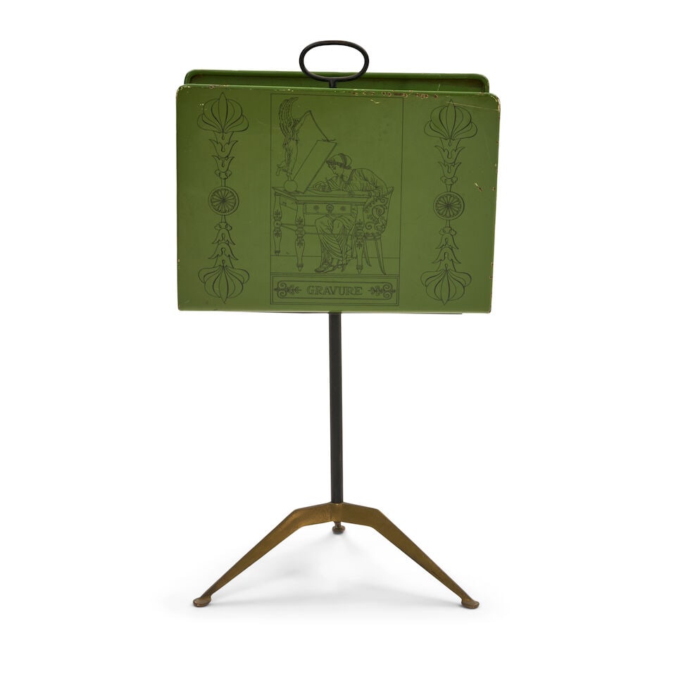 PIERO FORNASETTI (1913-1988) 'GRAVURE' MAGAZINE STAND Italy, early 1960s, brass, enameled iron, ...: PIERO FORNASETTI (1913-1988) 'GRAVURE' MAGAZINE STAND Italy, early 1960s, brass, enameled iron, transfer-decorated on enameled steel, unmarked, total ht. 30 1/2, rack ht. 13, wd. 17, dp. 9 in. Footnot
