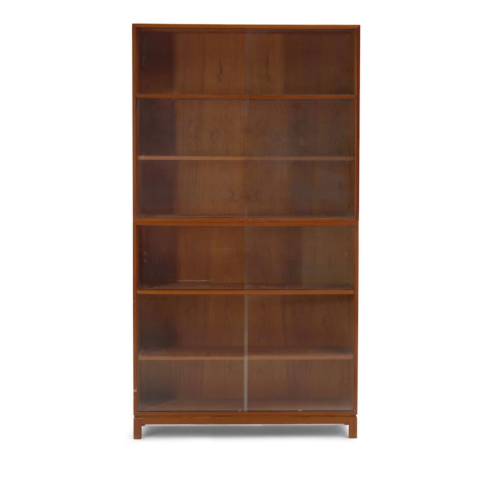 MID-CENTURY MODERN BOOKCASE Denmark, circa 1960, in two sections, each with one adjustable shelf...: MID-CENTURY MODERN BOOKCASE Denmark, circa 1960, in two sections, each with one adjustable shelf, teak veneer, teak, plywood, glass, ink stamp mark 'BM Made in Denmark,' ht. 75, wd. 41, shelves dp 9 t
